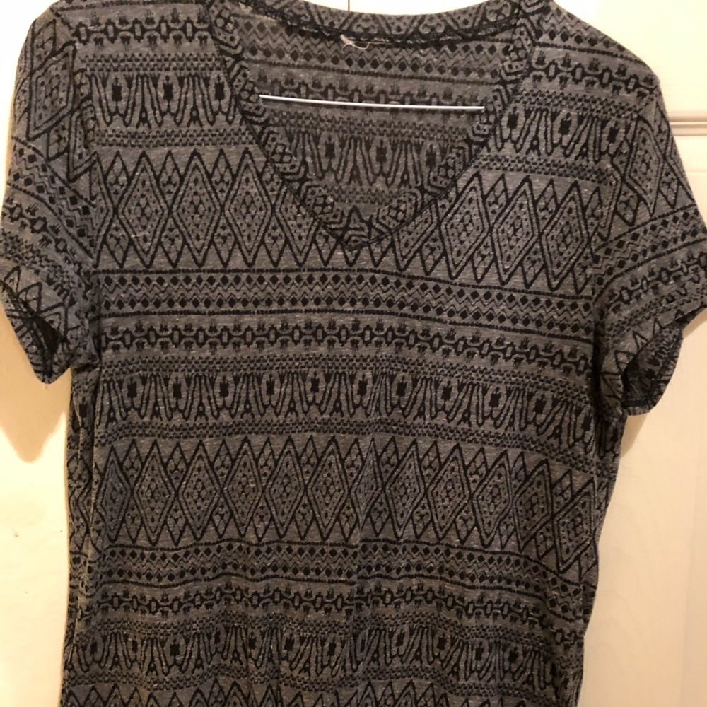 Black design on dark gray background